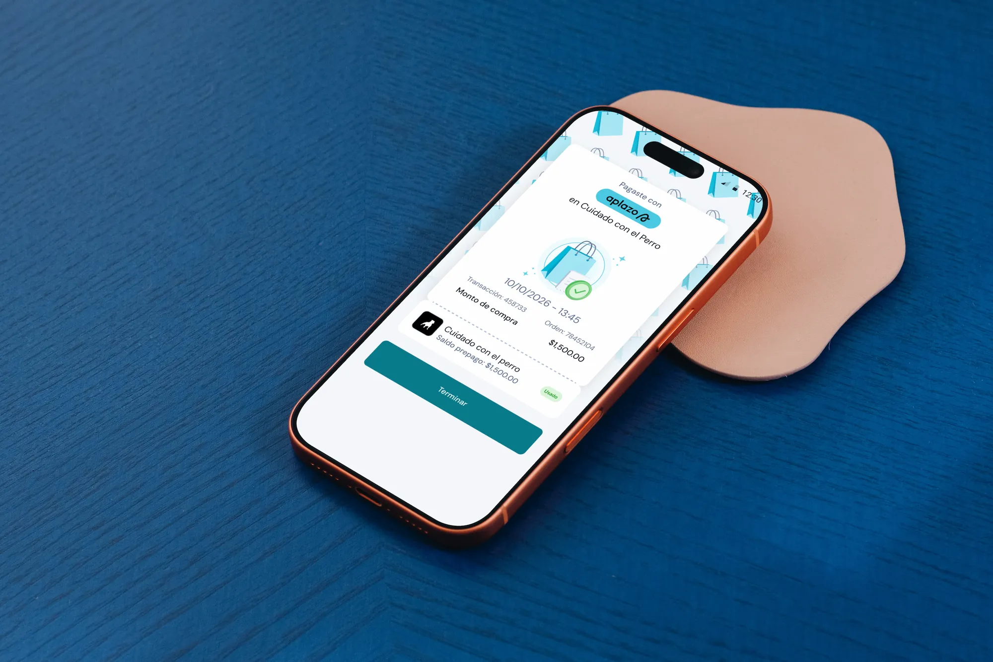 Aplazo onboarding screen on a phone on a blue surface